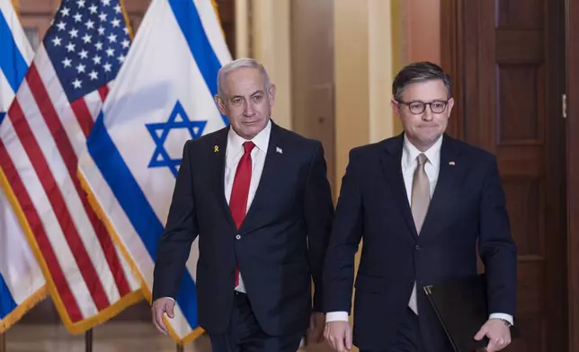 Israeli Prime Minister Benjamin Netanyahu, left, and Speaker of the House Mike Johnson, R-La., emerge from a meeting at the Capitol in Washington, Thursday, Feb. 7, 2025. (AP Photo/J. Scott Applewhite)