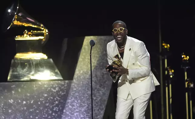 Cory Henry accepts the award for best roots gospel album for "Church" during the 67th annual Grammy Awards on Sunday, Feb. 2, 2025, in Los Angeles. (AP Photo/Chris Pizzello)