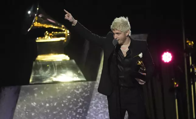 Andrew Watt accepts the award for best rock album for "Hackney Diamonds" on behalf of The Rolling Stones during the 67th annual Grammy Awards on Sunday, Feb. 2, 2025, in Los Angeles. (AP Photo/Chris Pizzello)