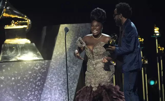 Tank and The Bangas accept the award for best spoken word poetry album for "The Heart, The Mind, The Soul" during the 67th annual Grammy Awards on Sunday, Feb. 2, 2025, in Los Angeles. (AP Photo/Chris Pizzello)