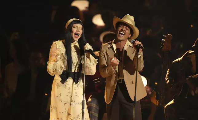 Lady Gaga, left, and Bruno Mars perform "California Dreamin'" during the 67th annual Grammy Awards on Sunday, Feb. 2, 2025, in Los Angeles. (AP Photo/Chris Pizzello)