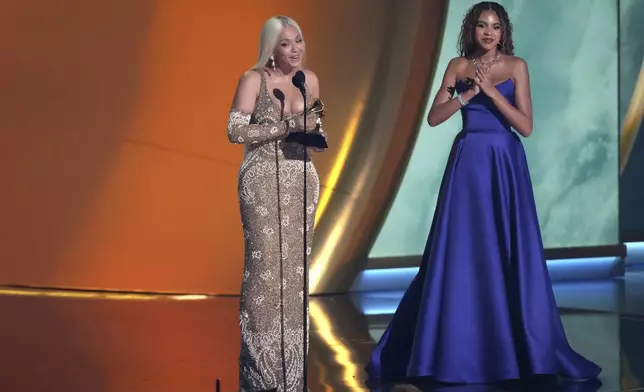 Beyonce accepts the award for album of the year for "COWBOY CARTER during the 67th annual Grammy Awards on Sunday, Feb. 2, 2025, in Los Angeles. Blue Ivy Carter looks on from right.(AP Photo/Chris Pizzello)