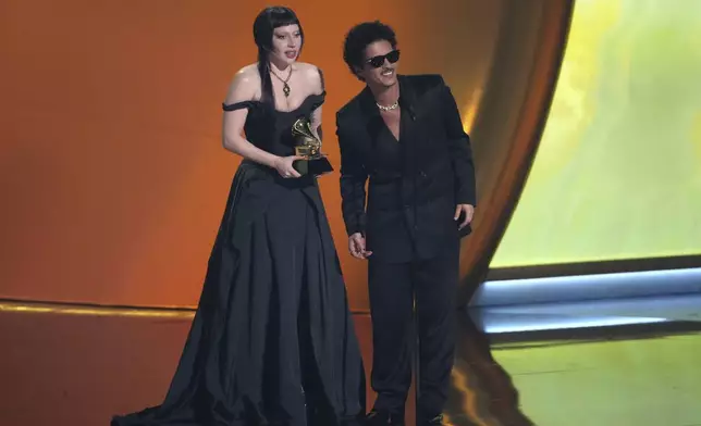 Lady Gaga, left, and Bruno Mars accept the award for best pop duo/group performance for "Die With A Smile" during the 67th annual Grammy Awards on Sunday, Feb. 2, 2025, in Los Angeles. (AP Photo/Chris Pizzello)