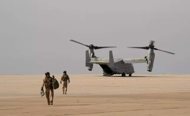 U.S. Marine pilots land an Osprey at the Naval Outlying Landing Field Friday, Jan. 31, 2025, in Imperial Beach, Calif. (AP Photo/Jae C. Hong)