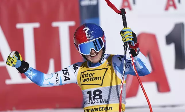 United States' Lauren Macuga celebrates at the finish area of a women's downhill race, at the Alpine Ski World Championships, in Saalbach-Hinterglemm, Austria, Saturday, Feb. 8, 2025. (AP Photo/Giovanni Auletta)