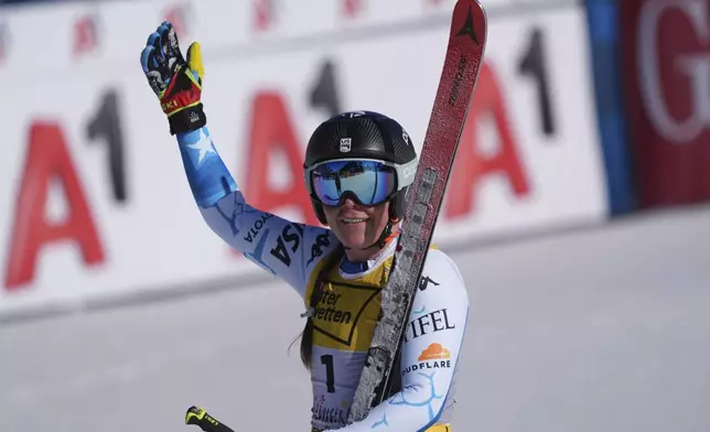 United States' Breezy Johnson celebrates at the finish area of a women's downhill race, at the Alpine Ski World Championships, in Saalbach-Hinterglemm, Austria, Saturday, Feb. 8, 2025. (AP Photo/Giovanni Auletta)