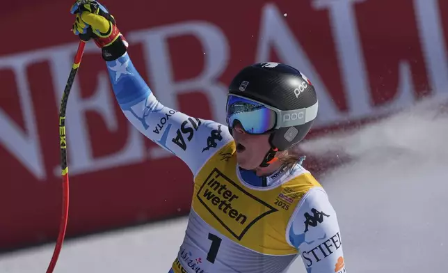 United States' Breezy Johnson celebrates at the finish area of a women's downhill race, at the Alpine Ski World Championships, in Saalbach-Hinterglemm, Austria, Saturday, Feb. 8, 2025. (AP Photo/Giovanni Auletta)