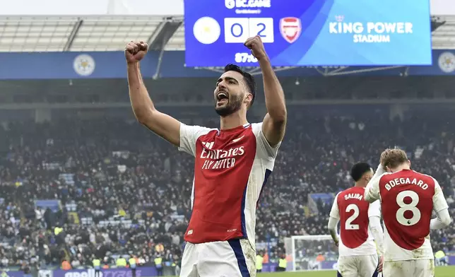 Arsenal's Mikel Merino celebrates after scoring his side's second goal during the English Premier League soccer match between Leicester City and Arsenal at King Power stadium in Leicester, England, Saturday, Feb. 15, 2025. (AP Photo/Rui Vieira)
