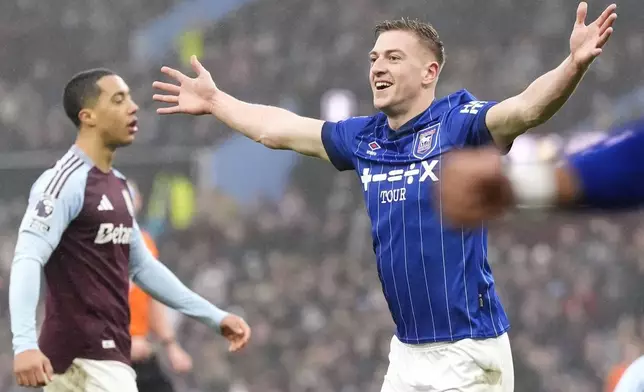 Ipswich Town's Liam Delap celebrates scoring their side's first goal of the game during the Premier League soccer match between Aston Villa and Ipswich at Villa Park, Birmingham, England, Saturday Feb. 15, 2025. (Nick Potts/PA via AP)