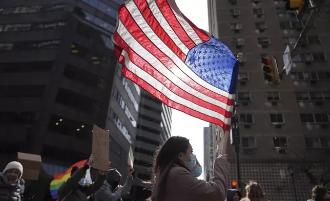 Protesters demonstrate against Project 2025, in Philadelphia, Wednesday, Feb. 5, 2025. (AP Photo/Matt Rourke)