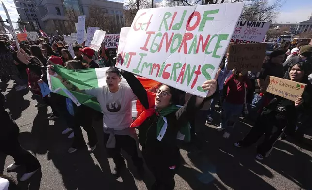 Participants cheer during a political protest outside the State Capitol Wednesday, Feb. 5, 2025, in Denver. (AP Photo/David Zalubowski)
