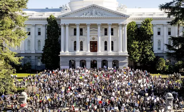 Several hundred demonstrators rally against President Donald Trump outside the California State Capitol on Wednesday, Feb. 5, 2025, in Sacramento, Calif. (AP Photo/Noah Berger)