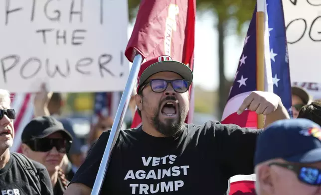 Ricardo Reyes, of Common Defense, shouts as he addresses the crowd as hundreds gather during a political protest at the Arizona Capitol Wednesday, Feb. 5, 2025, in Phoenix. (AP Photo/Ross D. Franklin)