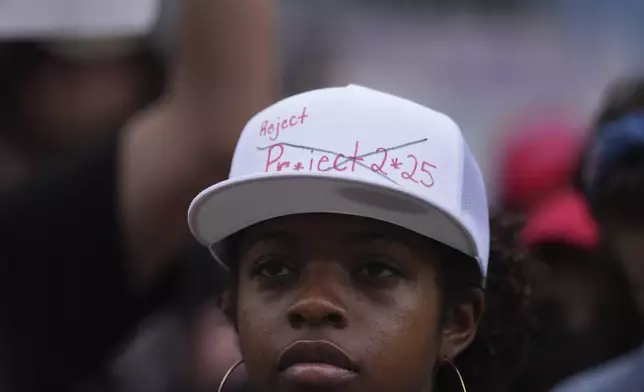 Protesters gather on steps of the Texas Capitol, Wednesday, Feb. 5, 2025, in Austin, Texas. (AP Photo/Eric Gay)