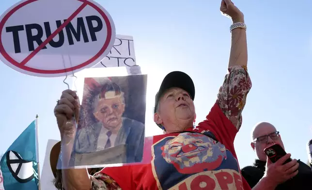 Tanni Wells chants while joining hundreds gathered during a political protest at the Arizona Capitol Wednesday, Feb. 5, 2025, in Phoenix. (AP Photo/Ross D. Franklin)