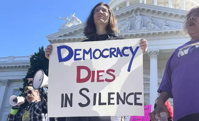 Demonstrators gather outside the state capitol for a political protest Wednesday, Feb. 5, 2025, in Sacramento. (AP Photo/Haven Daley)