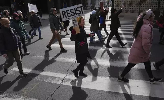 Protesters demonstrate against Project 2025, in Philadelphia, Wednesday, Feb. 5, 2025. (AP Photo/Matt Rourke)