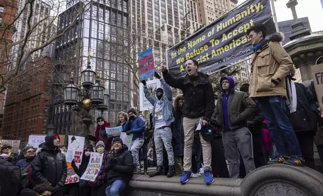 Demonstrators speak during a protest outside City Hall, Wednesday, Feb. 5, 2025, in New York. (AP Photo/Yuki Iwamura)