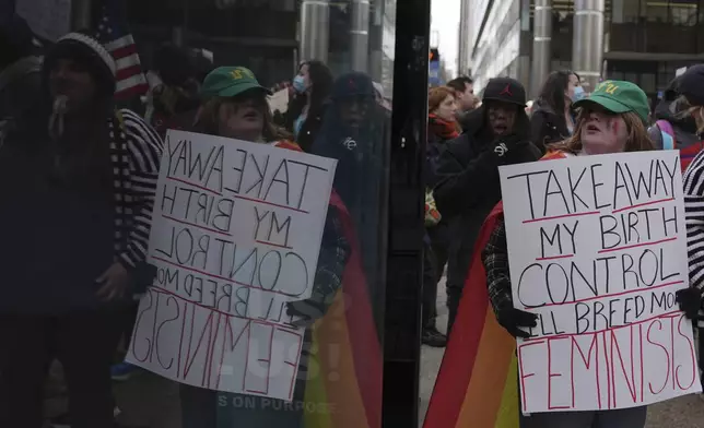 Protesters demonstrate against Project 2025, in Philadelphia, Wednesday, Feb. 5, 2025. (AP Photo/Matt Rourke)
