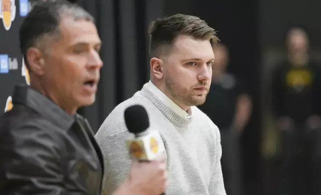 Los Angeles Lakers' Luka Doncic, right, and general manger Rob Pelinka field questions during an introductory NBA basketball press conference Tuesday, Feb. 4, 2025, in El Segundo, Calif. (AP Photo/Jae C. Hong)