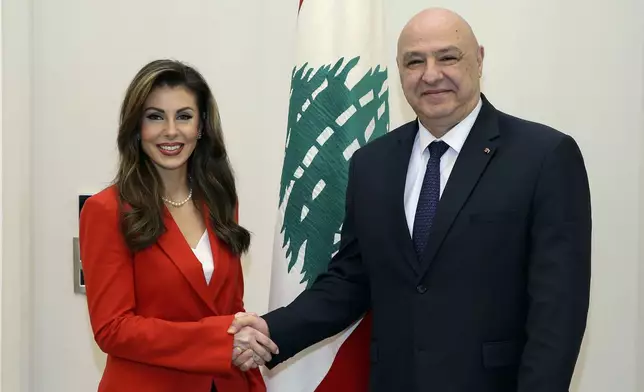 In this photo released by the Lebanese Presidency press office, Lebanese president Joseph Aoun, right, shakes hands with U.S. deputy special envoy for Middle East peace Morgan Ortagus in Baabda, east of Beirut, Lebanon, Friday, Feb. 7, 2025. (Lebanese Presidency press office via AP)