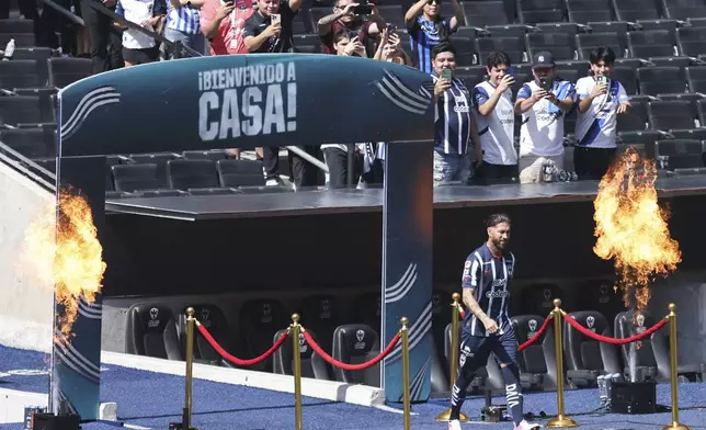 Fans take pictures of Spanish soccer player Sergio Ramos during his presentation at Monterrey, his new soccer club, in Monterrey, Mexico, Sunday, Feb. 9, 2025. (AP Photo/Jorge Mendoza)