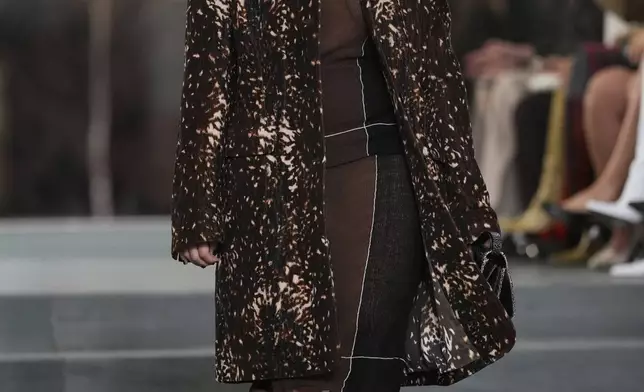 A model walks the runway during the Tory Burch Fall/Winter 2025 fashion show as part of New York Fashion Week on Monday, Feb. 10, 2025, at the Museum of Modern Art in New York. (Photo by Charles Sykes/Invision/AP)