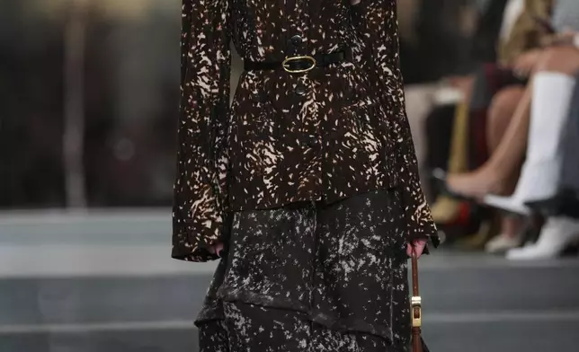 A model walks the runway during the Tory Burch Fall/Winter 2025 fashion show as part of New York Fashion Week on Monday, Feb. 10, 2025, at the Museum of Modern Art in New York. (Photo by Charles Sykes/Invision/AP)