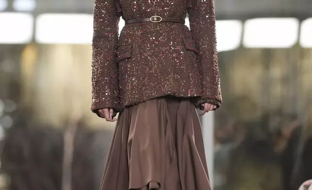 A model walks the runway during the Tory Burch Fall/Winter 2025 fashion show as part of New York Fashion Week on Monday, Feb. 10, 2025, at the Museum of Modern Art in New York. (Photo by Charles Sykes/Invision/AP)