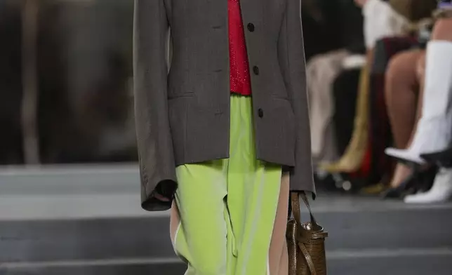 A model walks the runway during the Tory Burch Fall/Winter 2025 fashion show as part of New York Fashion Week on Monday, Feb. 10, 2025, at the Museum of Modern Art in New York. (Photo by Charles Sykes/Invision/AP)