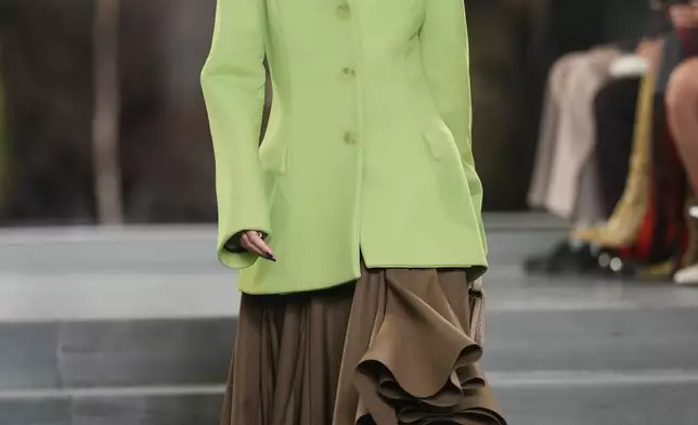 A model walks the runway during the Tory Burch Fall/Winter 2025 fashion show as part of New York Fashion Week on Monday, Feb. 10, 2025, at the Museum of Modern Art in New York. (Photo by Charles Sykes/Invision/AP)