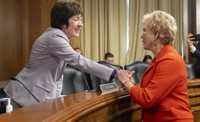 Sen. Susan Collins, R-Maine, left, greets Linda McMahon, President Donald Trump's nominee for Secretary of Education, at the start of a hearing of the Health, Education, and Labor Committee on McMahon's nomination, Thursday, Feb. 13, 2025, in Washington. (AP Photo/Jacquelyn Martin)