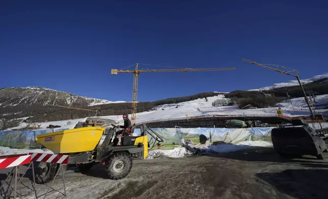 Construction work is seen at the Ski Area Mottolino, which will be called Livigno Snow Park, venue of the Freestyle and Snowboarding disciplines at the Milan Cortina 2026 Winter Olympics, in Livigno, Italy, Thursday, Jan. 16, 2025. (AP Photo/Luca Bruno)