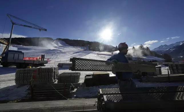 Construction work goes on at the Stelvio Ski Center, venue for the alpine ski and ski mountaineering disciplines at the Milan Cortina 2026 Winter Olympics, in Bormio, Italy, Thursday, Jan. 16, 2025. (AP Photo/Luca Bruno)