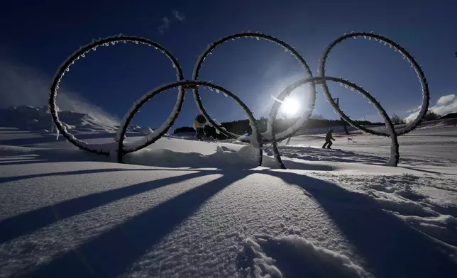 Olympic rings are seen in the snow at the Stelvio Ski Center, venue for the alpine ski and ski mountaineering disciplines at the Milan Cortina 2026 Winter Olympics, in Bormio, Italy, Thursday, Jan. 16, 2025. (AP Photo/Luca Bruno)