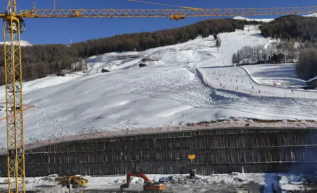 Construction work is seen at the Ski Area Mottolino, which will be called Livigno Snow Park, venue of the Freestyle and Snowboarding disciplines, at the Milan Cortina 2026 Winter Olympics, in Livigno, Italy, Thursday, Jan. 16, 2025. (AP Photo/Luca Bruno)