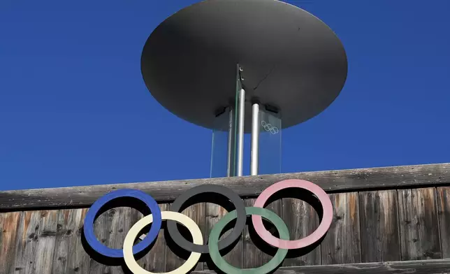 The Olympic rings adorn the Stadio Olimpico del Ghiaccio, which will be called Cortina Curling Olympic Stadium, venue for the curling discipline at the Milan Cortina 2026 Winter Olympics, in Cortina d'Ampezzo, Italy, Thursday, Jan. 16, 2025. (AP Photo/Giovanni Auletta)