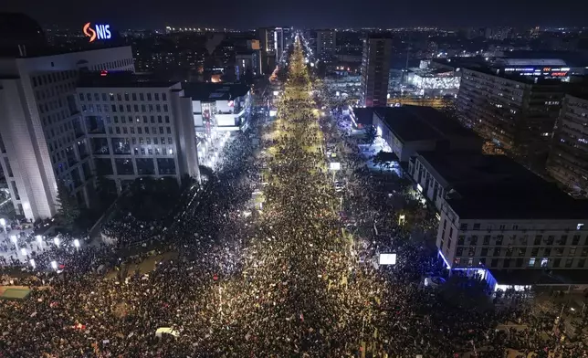An aerial view of people blocking the Bridge of Freedom during a protest over the collapse of a concrete canopy that killed 15 people more than two months ago, in Novi Sad, Serbia, Saturday, Feb. 1, 2025. (AP Photo/Armin Durgut)