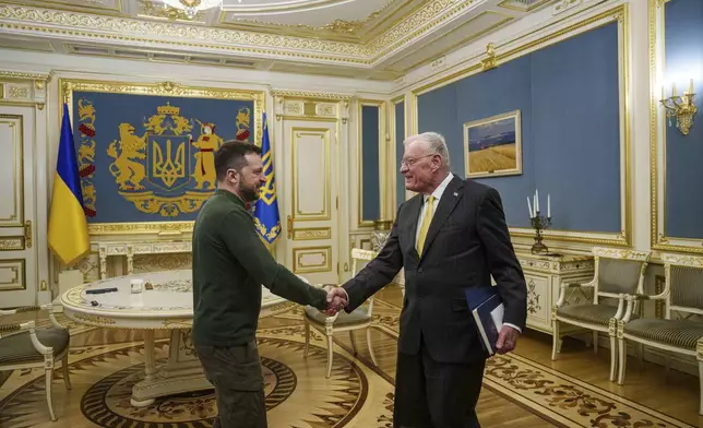 U.S. Special Envoy for Ukraine and Russia Keith Kellogg, right, and Ukraine's President Volodymyr Zelenskyy shake hands during their meeting in Kyiv, Ukraine, Feb. 20, 2025. (AP Photo/Evgeniy Maloletka)