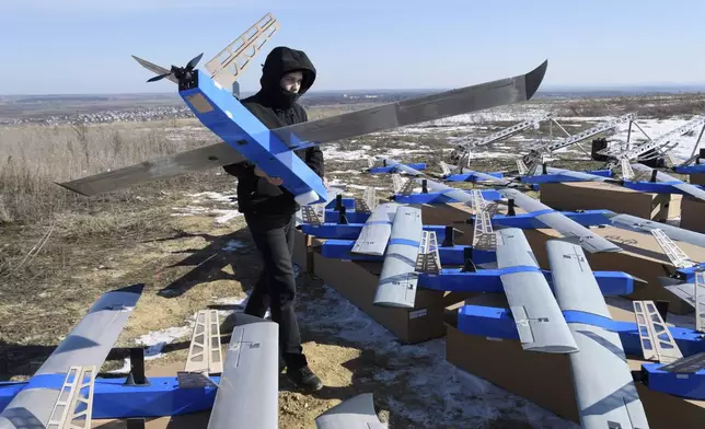 Ukrainian-made fixed-wing Besomar 3210 drone interceptors are handed over to the Armed Forces by Kozytskyi Charity Foundation in an undisclosed location in the Lviv region, western Ukraine, Friday, Feb. 21, 2025. (AP Photo/Mykola Tys)