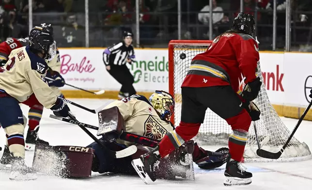 Ottawa Charge's Stephanie Markowski (6) scores on Montreal Victoire goaltender Ann-Renee Desbiens (35) during first period PWHL hockey action in Ottawa, on Saturday, Feb. 22, 2025. (Justin Tang/The Canadian Press via AP)