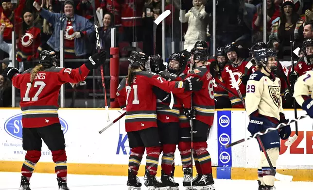 Ottawa Charge's Emily Clark (26) celebrates her empty net goal against the Montreal Victoire during third period PWHL hockey action in Ottawa, on Saturday, Feb. 22, 2025. (Justin Tang/The Canadian Press via AP)