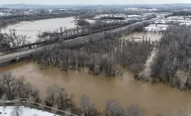 Portions of Basil Griffin Park in Bowling Green, Ky., Sunday, Feb. 16, 2025, sit submerged after heavy rainfall beginning early Saturday morning brought nearly five inches of rain to Warren County and after that snow blanketed the region. (Jack Dobbs/Daily News via AP)