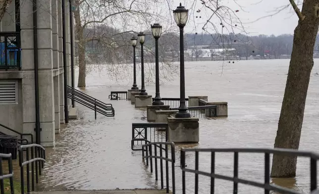 Water rises along the Cumberland River at McGregor Park, Sunday, Feb. 16, 2025, in Clarksville, Tenn. (AP Photo/George Walker IV)