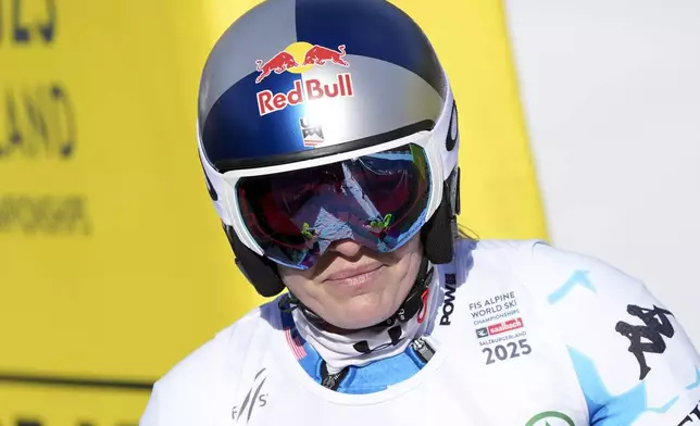 United States' Lindsey Vonn arrives at the finish area after crashing during a women's Super-G, at the Alpine Ski World Championships, in Saalbach-Hinterglemm, Austria, Thursday, Feb. 6, 2025. (AP Photo/Giovanni Auletta)