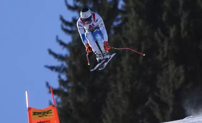 United States' Ryan Cochran Siegle is airborne during a men's downhill training, at the Alpine Ski World Championships, in Saalbach-Hinterglemm, Austria, Thursday, Feb. 6, 2025. (AP Photo/Giovanni Auletta)