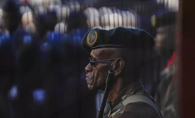 South African soldiers and veterans line up the street leading to Cape Town's city hall where South African President Cyril Ramaphosa will deliver his annual state of the union address Thursday, Feb. 6, 2025. (AP Photo/Nardus Engelbrecht)