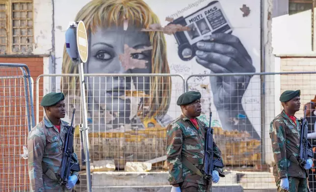 South African soldiers line the street leading to Cape Town's city hall where South African President Cyril Ramaphosa delivers his annual state of the union address, Thursday, Feb. 6, 2025. (AP Photo/Nardus Engelbrecht)