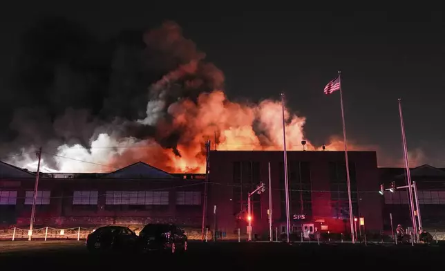 A fire engulfs SPS Technologies in Jenkintown, Pa., Monday, Feb. 17, 2025. (AP Photo/Matt Rourke)