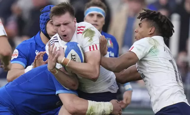 France's Leo Barre takes control of the ball, during the Six Nations rugby union match between Italy and France at the Olympic stadium, in Rome, Sunday, Feb. 23, 2025. (Alfredo Falcone/LaPresse via AP)